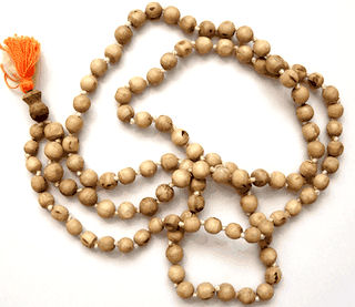 Hare Krishna Devotees Chant On Beads